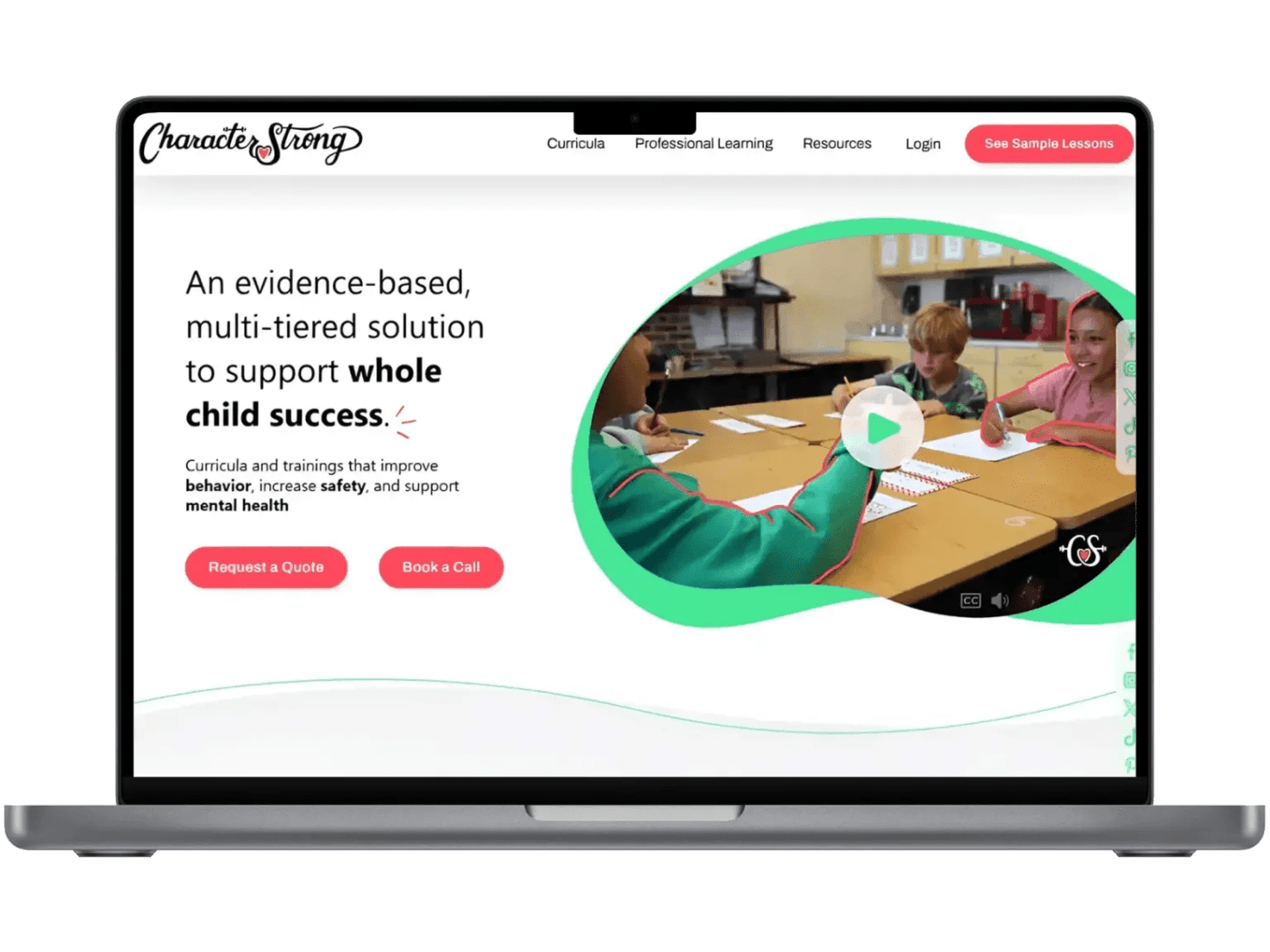The CharacterStrong site on a laptop, describing an evidence based multi tiered solution for whole child success, beside a video still of pupils working together at a table.